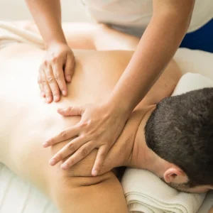 closeup-young-man-therapist-s-hands-giving-back-massage-spa-clinic